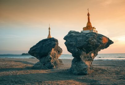 Two twin pagodas (Kyauk Maumghnama Pagoda) at Ngwe Saung beach, Bay of Bengal, Myanmar (Burma).